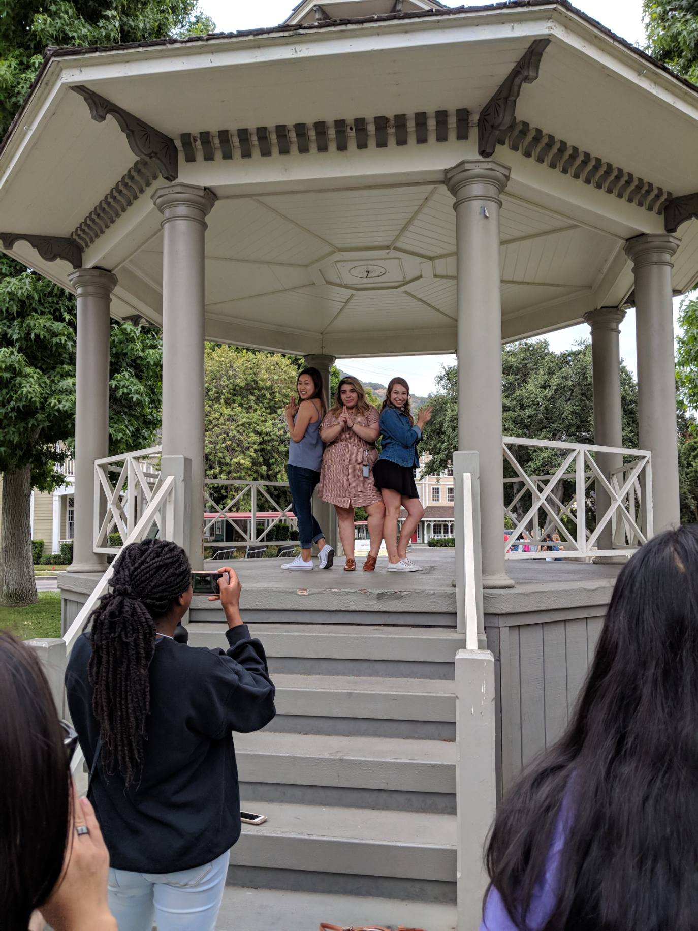 Group picture of the teaching team at the Gilmore Girls gazebo during a field trip