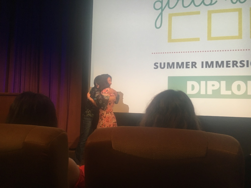 A student receiving her diploma