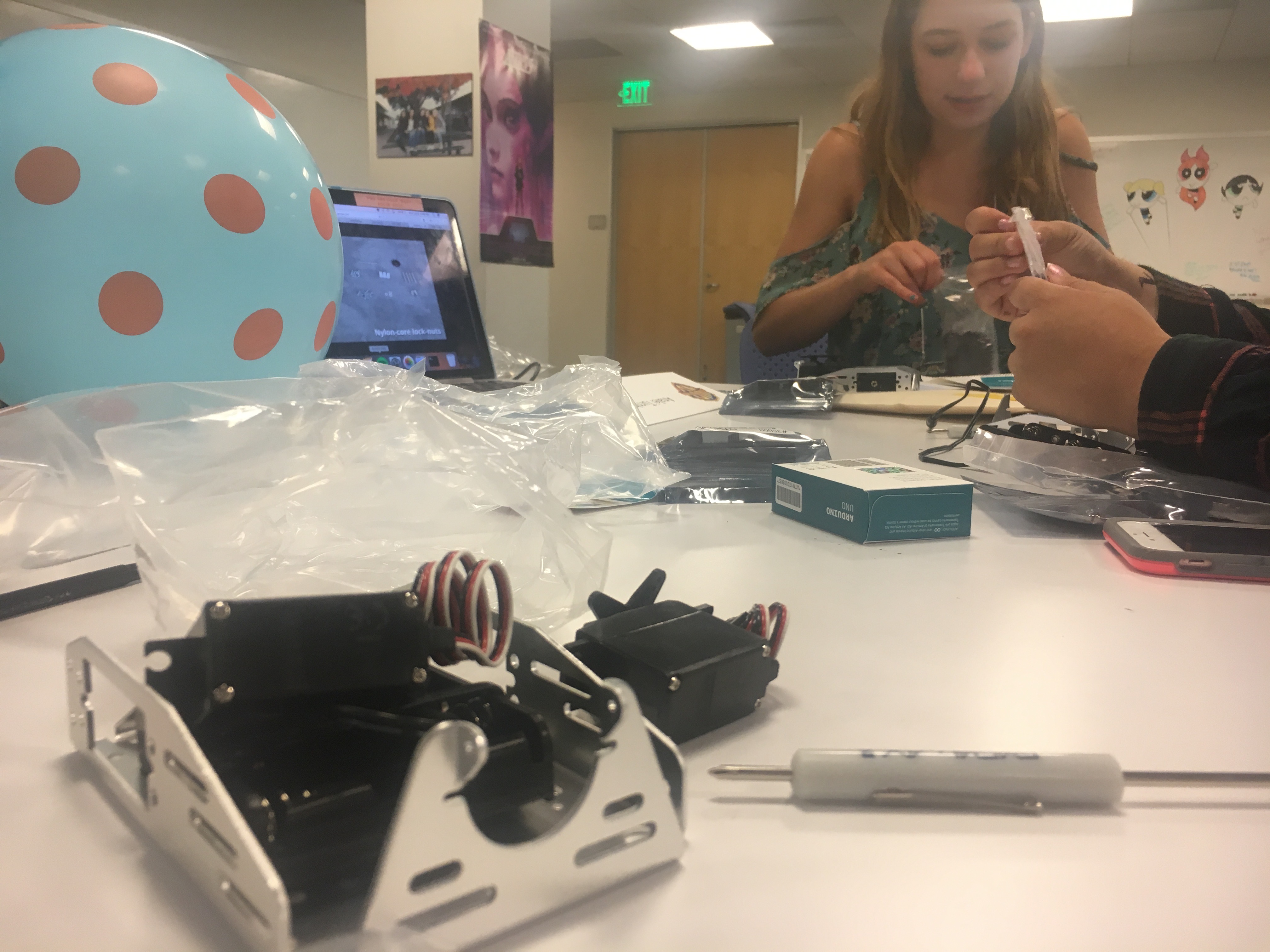The teaching team building robots in prepartion for the robotics unit